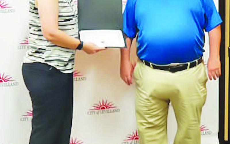 BADGE OF HONOR - Telecommunicator Kirk Bird received the Intermediate Telecommunicator Certificate on Friday at the LPD awards banquet. LPD Chief Erica O’Bryon presented the awards. (Photo courtesy of the LPD)