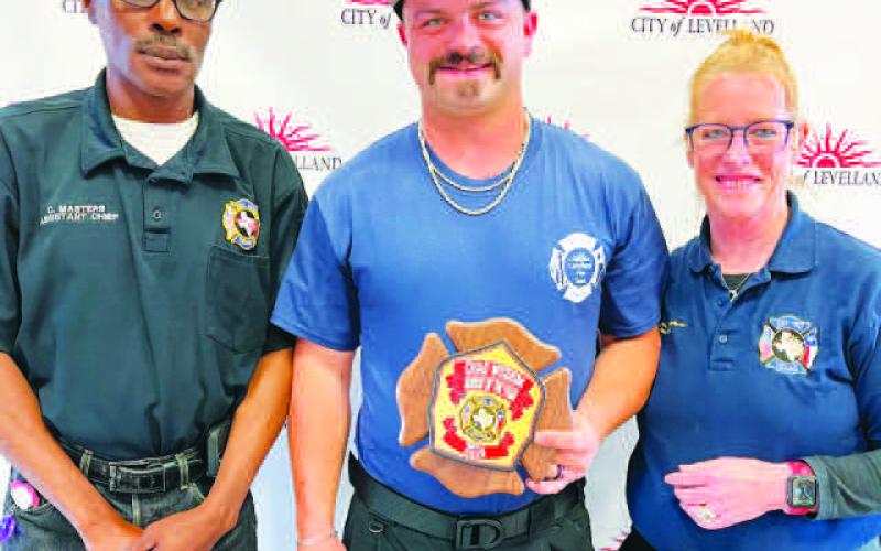 ROOKIE OF THE YEAR - Chad Wisdom (center) was awarded the Rookie of the Year Award on Saturday during the LFD awards banquet. Pictured alongside Wisdom is Curt Masters (left) and Interim Fire Chief Patty Byars-Faulkner (right). (Photo courtesy of the LFD)