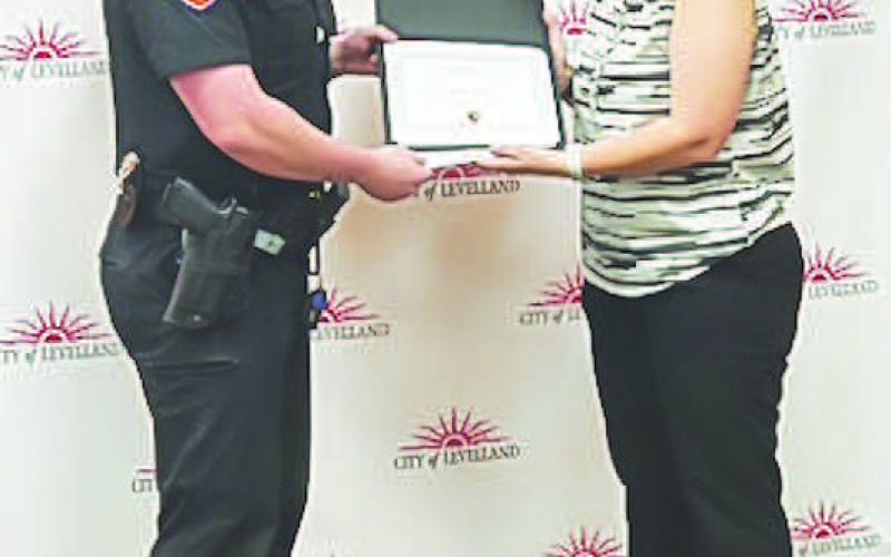 HARD WORK - Officer Parker received their Intermediate Certificate on Friday at the LPD awards banquet. LPD Chief Erica O’Bryon presented the awards. (Photo courtesy of the LPD)