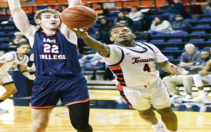 ACROBATIC MOVE - South Plains College sophomore guard Keith Richard leaves his feet and lays up a shot during their game against Snow College this past Thursday night at the Texan Dome. (Staff photo by Jentezen Smith)