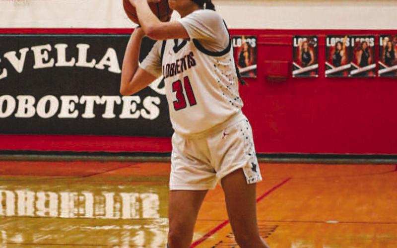 WIDE OPEN - Levelland Loboette Leilani Sanchez got wide open from behind the arch where she shot the ball for an easy three points during the team’s district opener at home. (Staff photo by Aalijah Soliz)