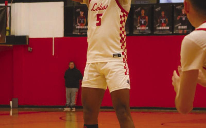 THREE-POINTER - Levelland Lobo Sean Landrum shot the ball from beyond the arc during the team’s game against Sundown at home this past Friday night. (Staff photo by Aalijah Soliz)