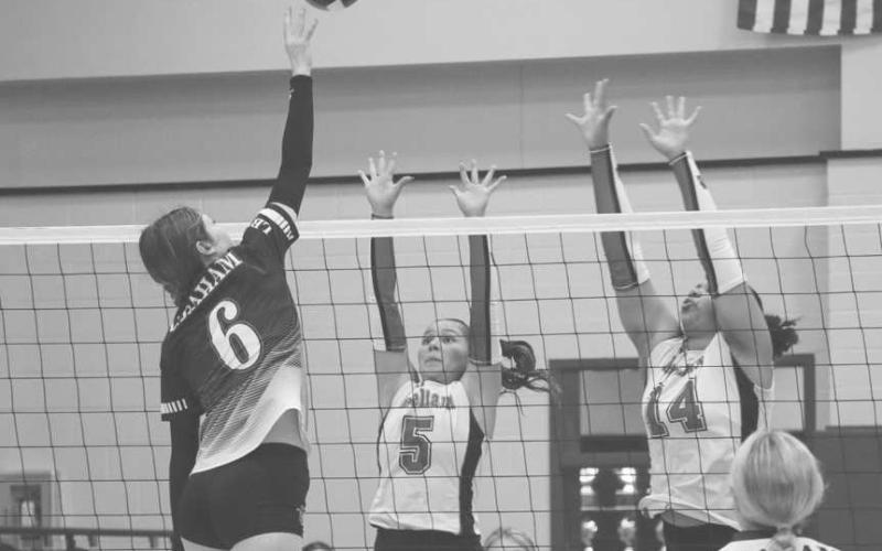 VERTICAL - Levelland Loboettes Allison Monge and Trinity Wafer jumped up to block the Graham Lady Steers shot during the team’s last game of the season in Colorado City. (Staff photo by Aalijah Soliz)