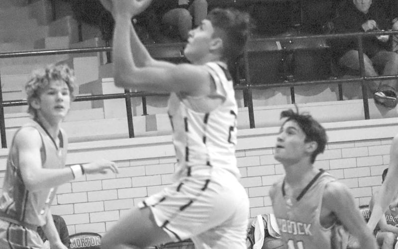 BREAKDOWN - Morton Indian E.J. Rivas broke the zone defense of the Lubbock Titans last week at home where he layed the ball up getting the team some much needed points. (Staff photo by Aalijah Soliz)