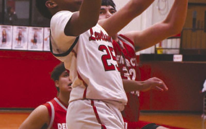 FINGER ROLL- The Levelland Lobos got a much needed 53-36 home win over Denver City Friday. Jayden Castillo put in a lay-up with a finger roll. Levelland will be back in action starting December 28th at the Canyon Tournament. (Staff Photo by Dom Puente)