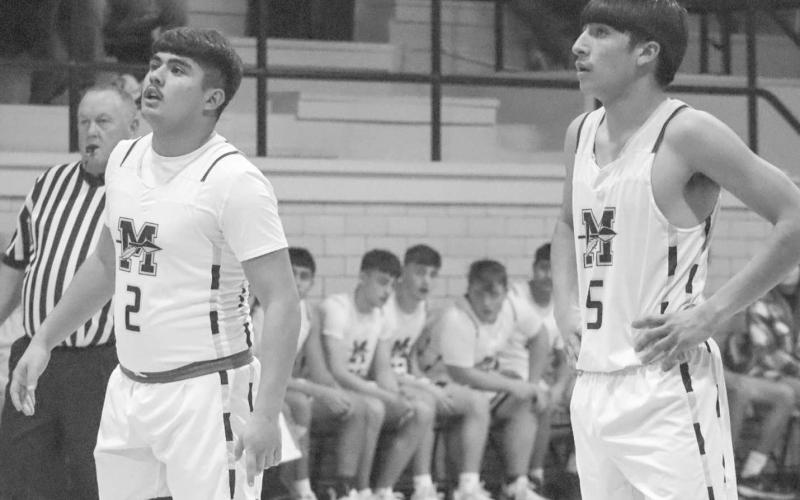 DUO - Morton Indians Andres Bejarano and Alex Lopez watched their teammate shoot their free throws during the team’s big win over the Lubbock Titans this past Tuesday at home. (Staff photo by Aalijah Soliz)