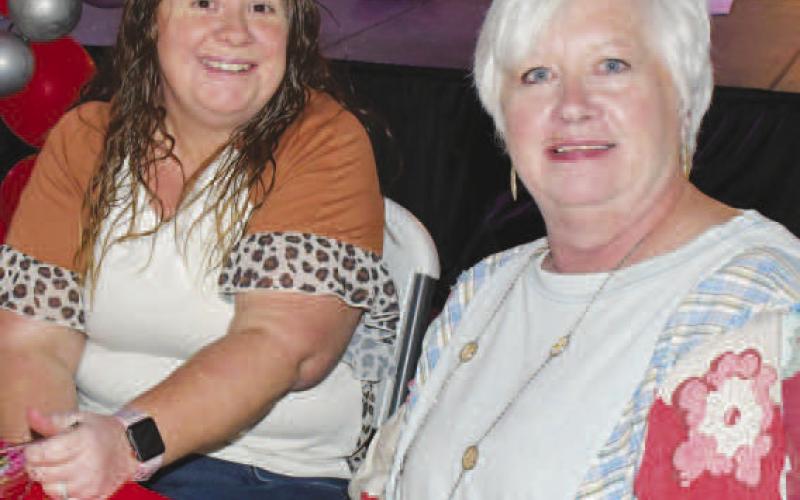 STAGE VIEW – Darla Burton and Tori Elliott ate and talked together at their reserved table for the Fa La La event in Levelland Dec. 12. (Staff photo by Evin Thomas)
