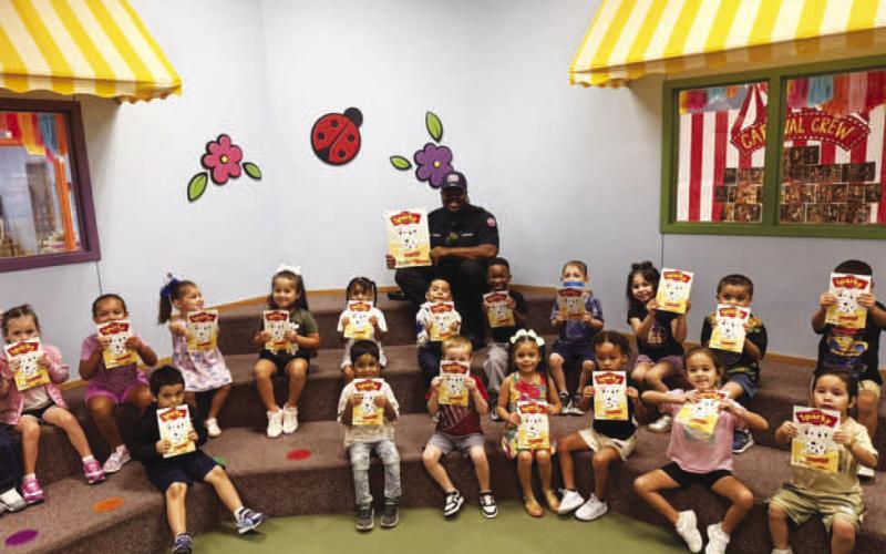READING HERO - Fireman Derek Lewis took out time to read to students at Levelland ABC. Lewis sent the students home with a fire safety book to share with their families. If you would like to volunteer to be a reading hero, contact the Levelland ISD Administration office at 806-894-9628.