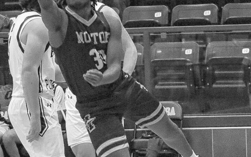 ATHLETIC FINISH - Morton Indian Tra Holland made the tough finish after the foul during the team’s game against Roscoe in their Area Round matchup. (Staff photo by Aalijah Soliz)