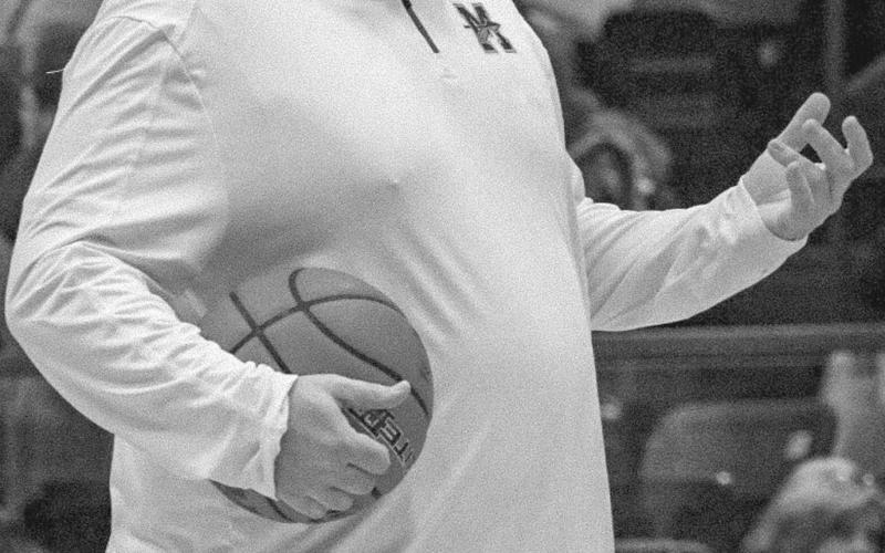 WARM-UPS - Head Basketball Coach Andrew Brockman got his team ready during their Area Round in his first year as the team’s coach. (Staff photo by Aalijah Soliz)