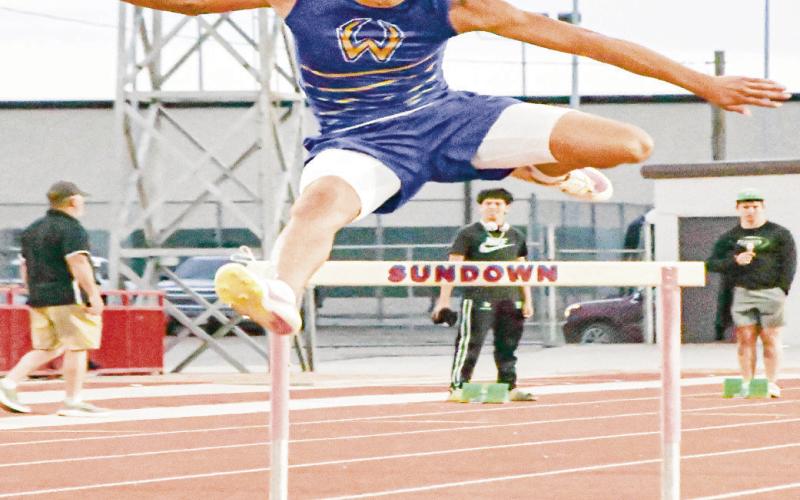 SUB-40 CLUB - Whiteface’s Isaak Soliz clears a hurdle during the 300-meter hurdles this past Friday at the District Championships at Sundown High School. Soliz would dip below 40 seconds with a 39.19 in the race. (Staff photo by Jentezen Smith)