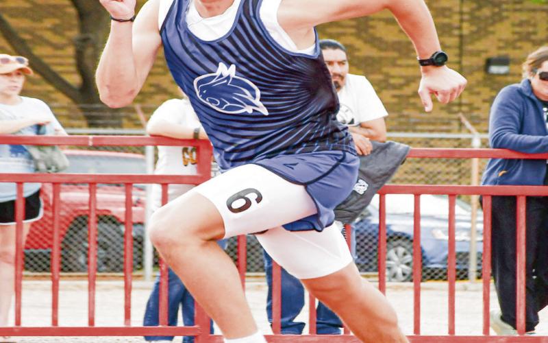 DISTANCE MACHINE - Smyer’s Austin Martinez sprints out to start his 800-meter race this past Friday at the District Championships at Sundown High School. Martinez would medal in several distance events. (Staff photo by Jentezen Smith)