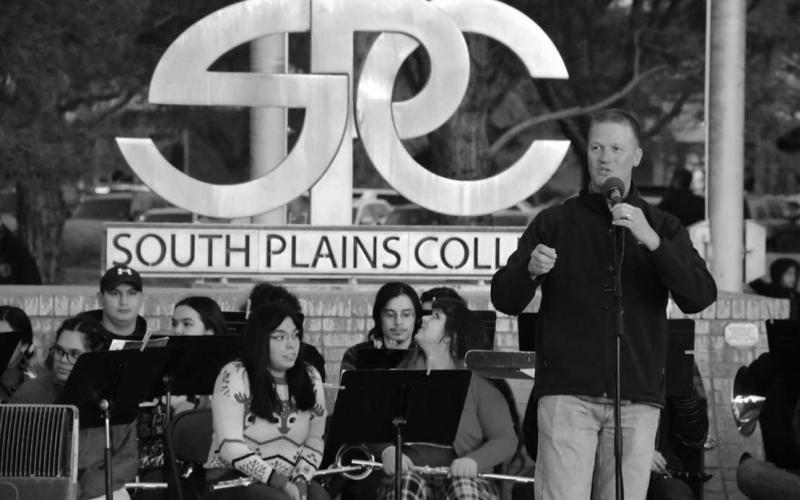 TRADITION OF LIGHTS - South Plains College President Dr. Robin Satterwhite gave a short speech during the lighting of the trees at the Levelland campus Thursday. The lighting of the trees was incorporated with the Festival of Lights event that is held by the Levelland MainStreet program. Additionally, the lighted parade route was adjusted to go through the campus to include students on campus and strengthen the relationship between the community of Levelland and SPC. (Staff Photo by Dom Puente)