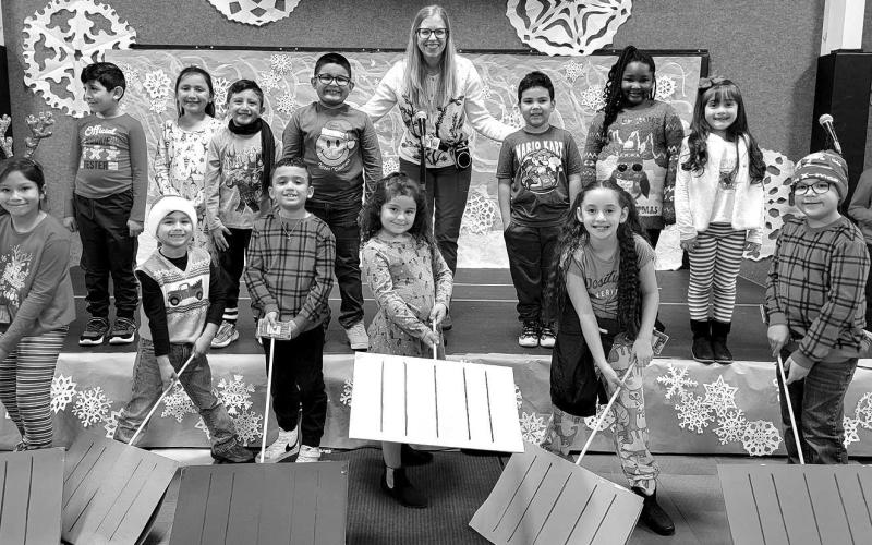 LET IT SNOW! LET IT SNOW!– Capitol second grade held its performance of “On With The Snow!” The program included rappers and snow shovelers, under the direction of Capitol Music Teacher Miss Draper. Pictured are rappers: Joshua Barrientes, Layla Carranza, Dania Corrales, Leonardo Ochoa Perez, Titus Phillips and Keilany Rosales; and shovelers: Giovanni Aguilar, Ximena Faria Hernandez, Kaylee Garza, Cruz Martinez, Aaron Santos, Journee Taylor and Jose Ybarra, and Miss Susan Draper. (Submitted Photo)