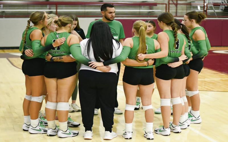 STACKING WINS - The Ropes Lady Eagles volleyball team and coaches huddle up during a match earlier this season. Following their most recent win against Tahoka, the Lady Eagles improved to 29-9 overall and 8-1 in district play this season. (Staff photo by Jentezen Smith)
