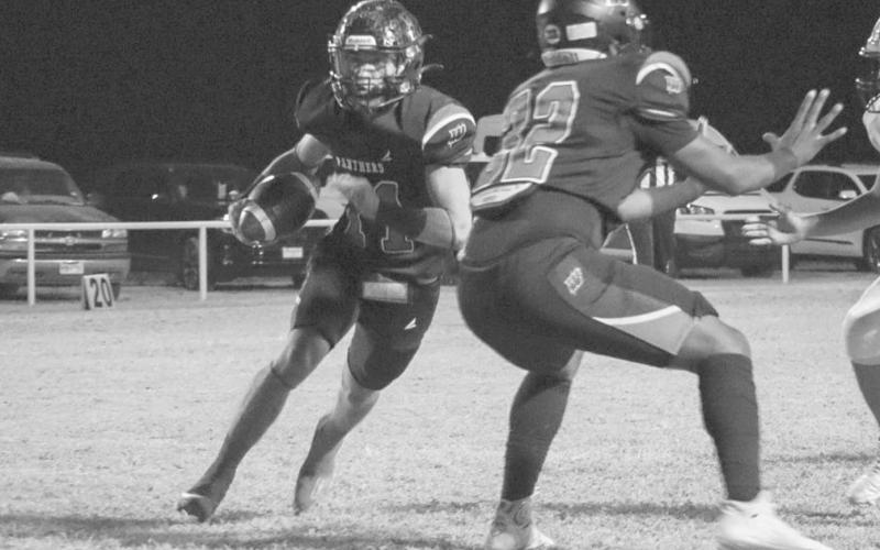 SHIFTY - Whitharral Panther Jack Griffin weaved through traffic last Friday night against the Anton Bulldogs with Panther Nathan Samson blocking for him during the team’s district championship win. (Staff photo by Aalijah Soliz)