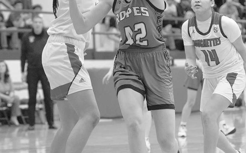UNDER MOVE- Lady Eagle Ava Grace Falls slipped under a Sundown defender in a losing effort against the Roughettes (Photo Courtesy of Donovan Martin)