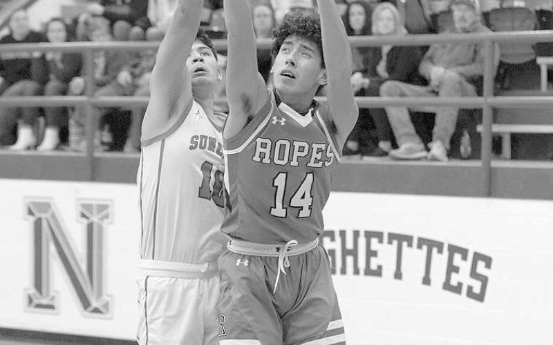 REJECTION- Ropes Eagle E. J. Mendoza had his shot attempt blocked by Sundown defender Nick Delacerda in a 60-51 district road loss. (Photo Courtesy of Donovan Martin)