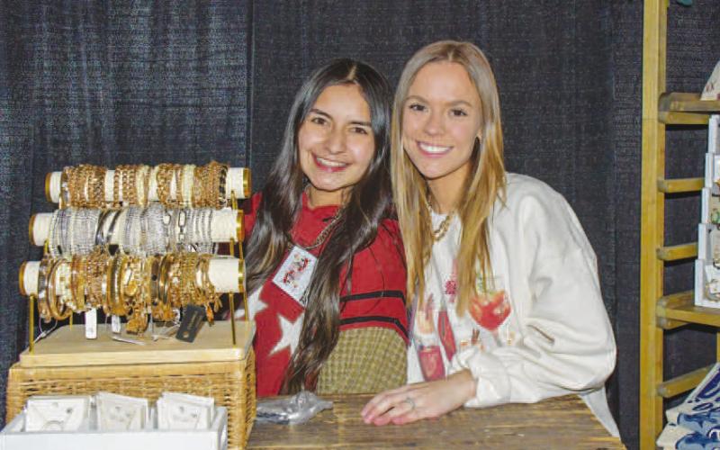 DESERT NOMAD – Brittany Weddige and Klair Stowers worked as vendors at the Desert Nomad stand set up for attendees of the Fa La La event in Levelland, Dec. 12. (Staff photo by Evin Thomas)