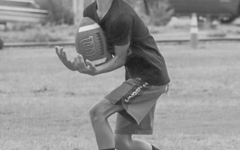 ARMS TUCKED - Cade Hiler caught the ball this past Monday at the Ropes Eagle Football Camp held at the Ropes Football Field. (Staff photo by Aalijah Soliz)