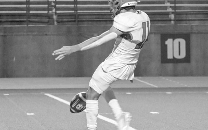 PUNT - Sundown Roughneck Marcus Solis punted the ball against the Wink Wildcats this past Thursday night in Odessa during the team’s playoff game. (Staff photo by Aalijah Soliz)