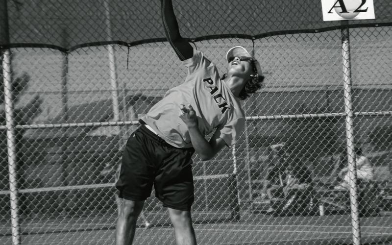 AT YOUR SERVICE - Diego Franco performs an overhand serve for the Levelland Tennis Pack during a match against Frenship Memorial this past Tuesday. The Pack would go on to lose 16-3. (Staff photo by Jentezen Smith)