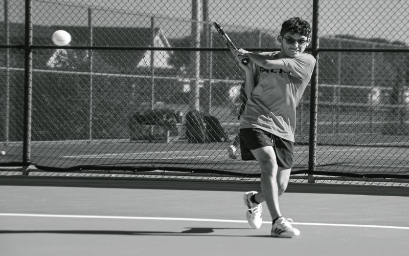 ZACK ATTACK - Levelland tennis senior Zackary Lopez puts a big swing on the ball during a match against Frenship Memorial this past Tuesday at the Levelland tennis courts. The Pack would go on to lose 16-3, which is a misleading score in what was a hard fought battle. (Staff photo by Jentezen Smith)