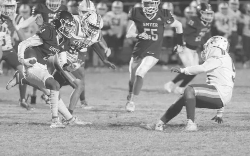 TOO QUICK - Smyer Bobcat Ryan Gutierrez juked to the defenders outside shoulder to make him fall this past Friday during Smyer’s last game of the season against Tahoka. (Photo courtesy of Joe-Andrew Garcia)