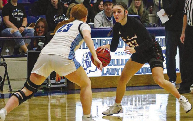 ONE ON ONE - Levelland Loboette Presley Smith went head to head against the Decatur Lady Eagle this past Friday night at Stamford for the team’s last game of the season. (Staff photo by Aalijah Soliz)