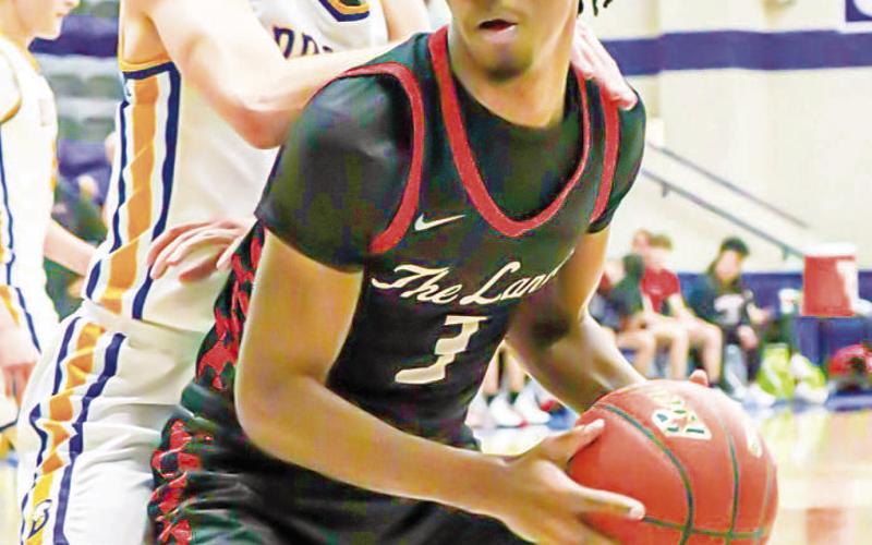 BACK DOWN - Levelland Lobo Eryk Jones backed down his defender after getting the inbound pass this past Monday night in Stamford during the team’s last game of the season. (Staff photo by Aalijah Soliz)