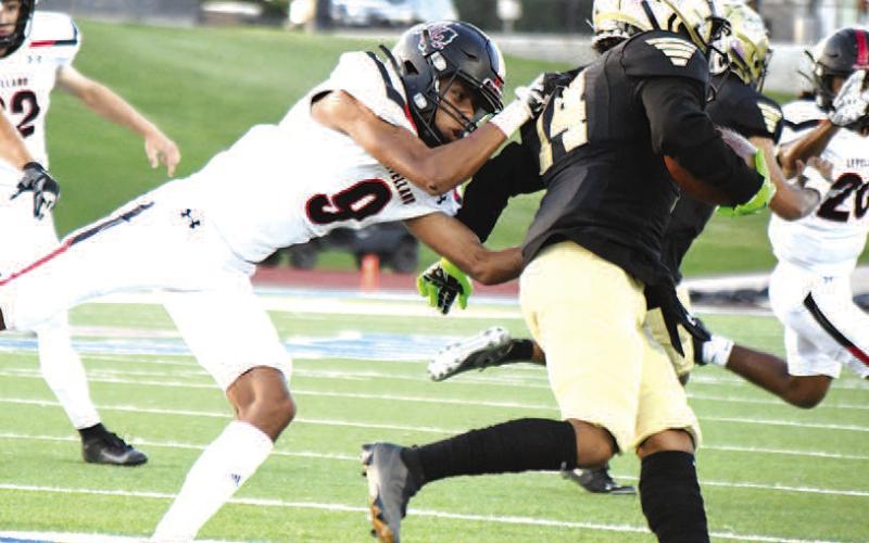 LOBO TACKLER- The Levelland Lobos fell to 0-3 after a Thursday loss against the Lubbock High Westerners 21-14 on the road in Lubbock. Lobo Matthew Bautista pulled down a Lubbock High ball carrier during the game. The Lobos will welcome the Estacado Matadors in to town for homecoming next Friday. (Staff Photo by Dom Puente)