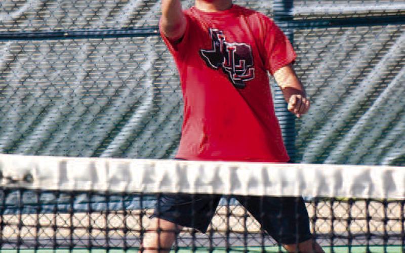 JVRETURNSERVE- The Levelland junior varsity tennis team moved to 2-0 in district and 11-8 overall with a win over Brownfield. Hector Larrea is pictured returning a serve during one of his matches. (Staff Photo by Dom Puente)