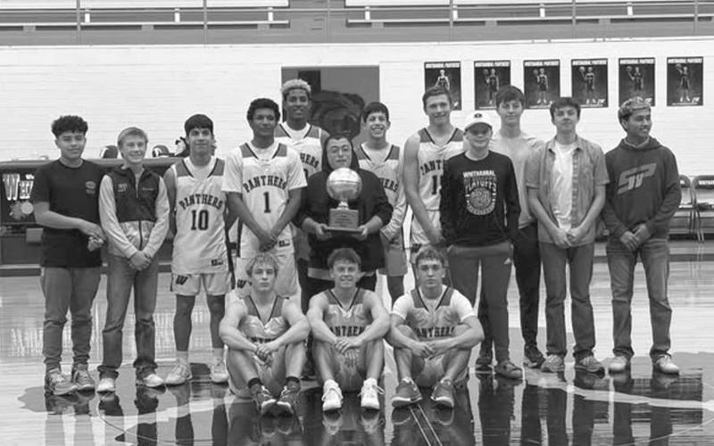 DISTRICT CHAMPS - The Whitharral Panthers earned their second straight district championship this past Tuesday night after beating the Wellman-Union Wildcats 98-29 at home. Pictured above are the Panthers holding their trophy after going undefeated in district play. The Panthers Bi-District Round of playoffs are against the Sands Mustangs at Roosevelt High School in Lubbock. (Photo courtesy of Whitharral ISD)