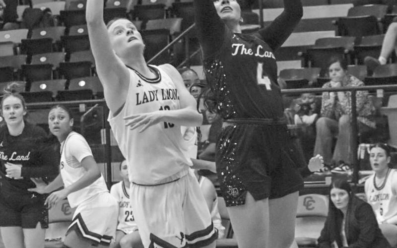 CAN’T GUARD ME - Levelland Loboette Mia Morin layed the ball up with a defender on her back during the team’s first playoff game against the Lady Lions this past Monday night. (Staff photo by Aalijah Soliz)
