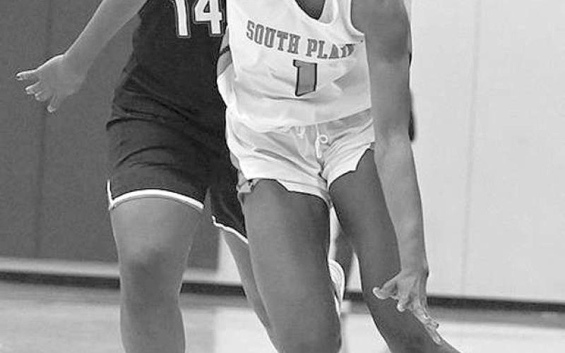 ESCAPINGPRESSURE- The South Plains College women’s basketball team fell to top-ranked Trinity Valley 58-41 last Saturday at the Al G. Langford Chaparral Center. Lady Texan Lydie Mwamba dribbled up the sideline. (Photo Courtesy of Jordan Irvine)