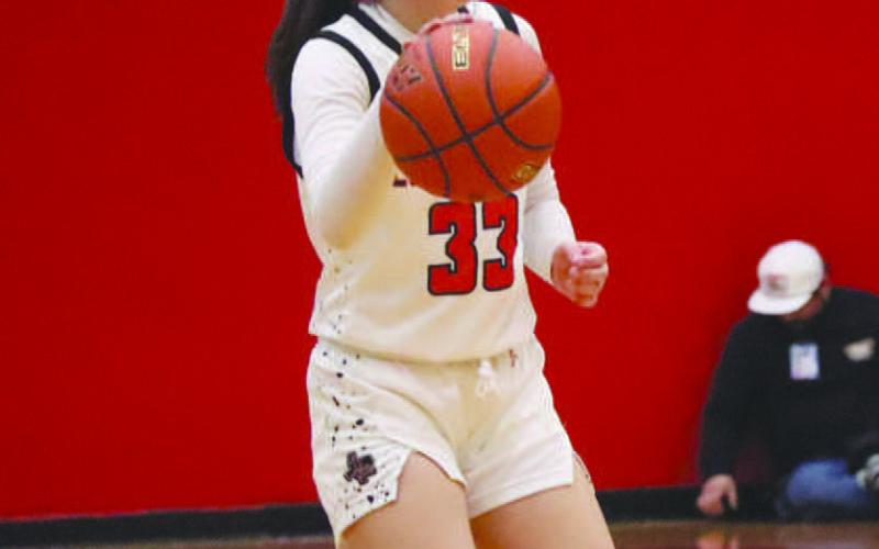 DOWNHILL - Levelland Loboette Presley Smith brought the ball up the court during their contest last week against the Big Spring Lady Steers in the teams win. (Staff photo by Aalijah Soliz)