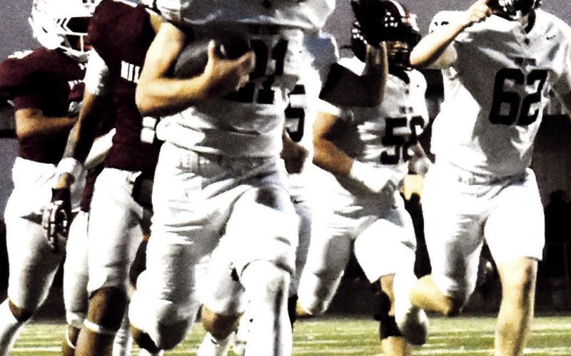 LHS Lobo charges down field for a touchdown. (staff photo)