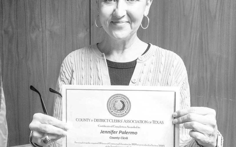 CERTIFICATE OF COMPLETION - During the Hockley County Commissioners’ regular meeting Monday morning, the Commissioners accepted the Certificate of Completion awarded to Hockley County Clerk, Jennifer Palermo. (Staff photo by Dom Puente)