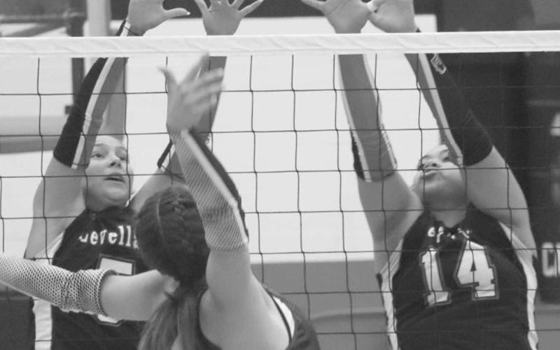 CLOSE CALL - Loboettes Trinity Wafers and Alison Monge jumped high over the net this past Tuesday at home against the Littlefield Lady Cats. (Staff photo by Aalijah Soliz)