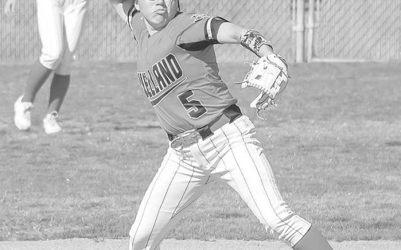STAYING WARM- Loboette took down Snyder Lady Tigers in doubleheader at Levelland High School. Game one went to the Loboettes, 11-6. In game two the Loboettes completed the sweep, 133. Loboette Delany Delgado warmed up in between innings. (Staff Photo by Dom Puente)