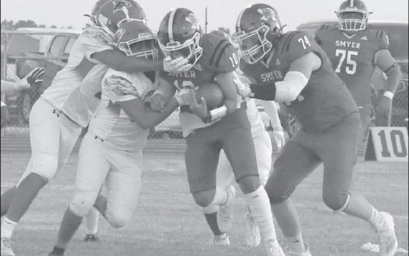 RUN PLAY - Peyton Casillas, coming off an injury against Ralls in the week prior, had multiple carries for the Smyer Bobcats in a 42-20 homecoming loss to the Floydada Whirlwinds. The Bobcats will travel to Clarendon next Friday for a 7 p.m. game. Clarendon is currently ranked 18th in class 2A-2 by MaxPreps. Last season the Broncos defeated the Bobcats 55-8 in Smyer. (Staff photo by Jay Kelley)