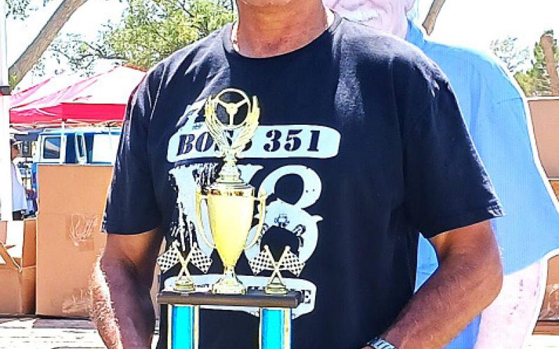 BEST OF SHOW – Abel Rios with a red 1971 Ford Boss 351. (staff photo)