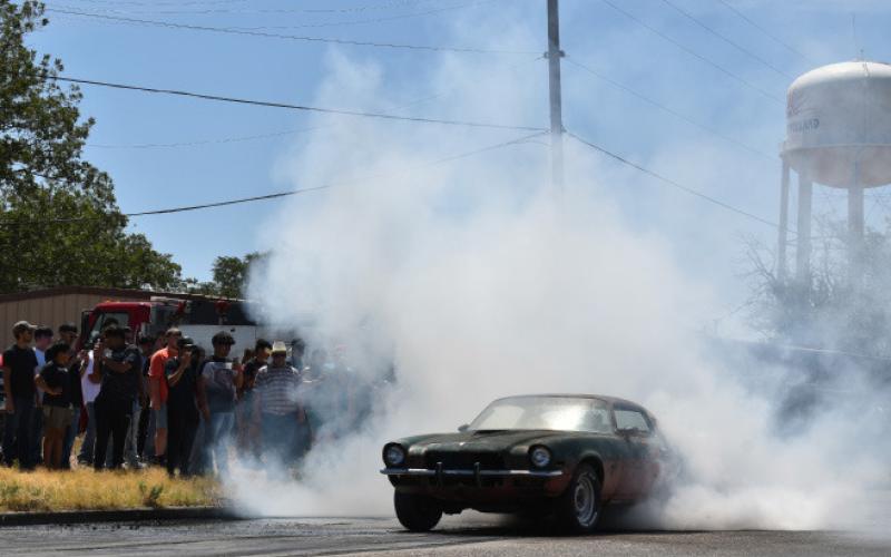BURNOUT – Drivers put on a show at the burnout competition last Saturday at the 20th annual Thunder on the Plains car show. Participants competed in three rounds for a chance at the podium and King of the Hill. (Staff photo by Ada Niederhauser)