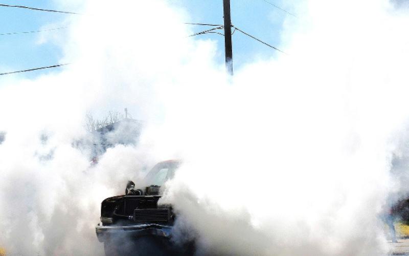 PUTTING ON A SHOW – The 20th annual Thunder on the Plains car show featured the popular burnout competition. Many competitors had been participating in the burnout for years and put on a show for those watching. (Staff photo by Ada Niederhauser)