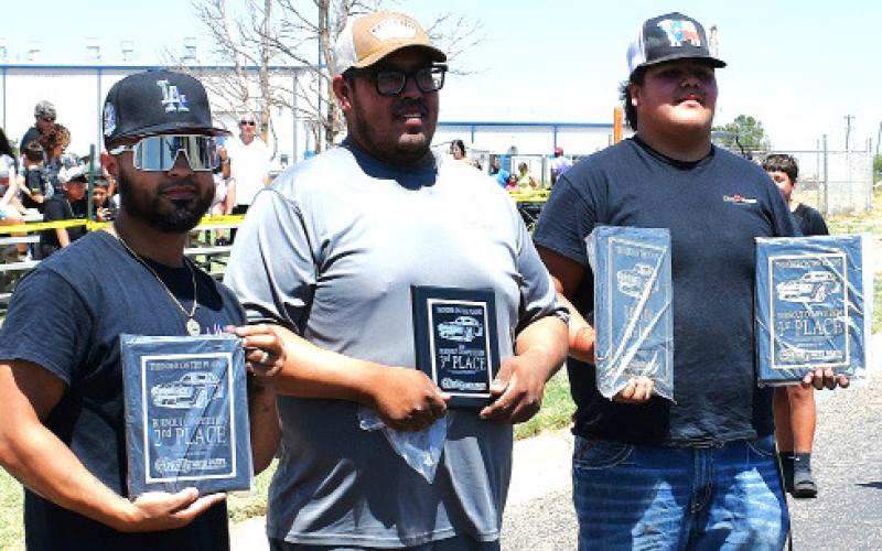 BURNOUT WINNERS – Cruz, second place; Ricardo Perez, third place; Edwin Ochoa, first place and King of the Hill. (Staff photo)