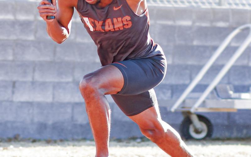 GOTTA GET OUT - South Plains College’s Zion Miller drives out of the blocks to get a good start in the 4x400meter relay at the SPC West Texas Shootout this past Saturday at the South Plains College track facility. (Staff photo by Jentezen Smith)