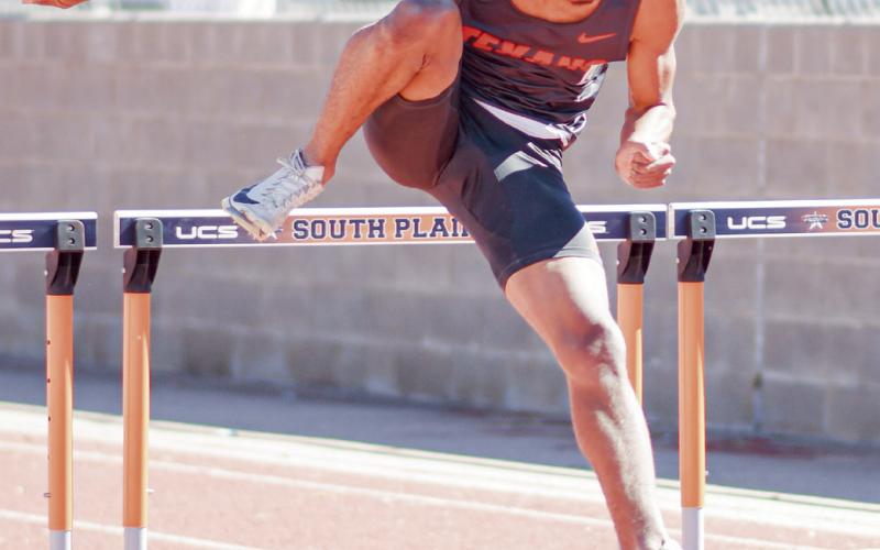 HURDLE FORM - SPC’s Jamison Lewis pulls his trail leg through the hurdle at the SPC West Texas Shootout this past Saturday at South Plains College.. (Staff photo by Jentezen Smith)