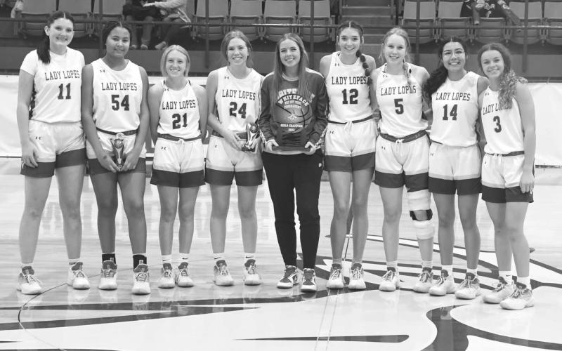 WINNERS - The Whiteface Lady Lopes were tournament champions at their Way Out West High School Basketball Tournament last weekend. Pictured are, from left to right: Kylie Deavours, Timmyah Olenga, Emily Blankenship, Hannah Blankenship, Emma Ayers, Abi Soliz, Jaedyn Rector, Anais Soliz, Lainey Sanders. (Staff photo by Jay Kelley)