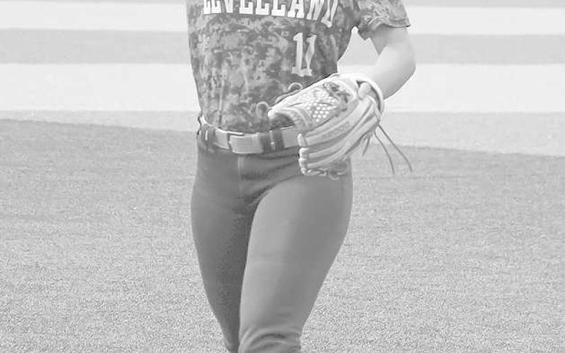 STAYING WARM- The Levelland Loboette softball team participated in summer league action at Sundown High School Tuesday. Loboette Madison Seat warmed up in between innings during their match-up against the Roughettes. (Staff Photo by Aalijah Soliz)