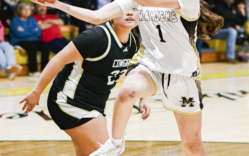 UNDERHAND LAYUP - Morton Maiden Addy Sabala shoots an underhand layup during their district game against Plains this past Tuesday at Morton High School. Sabala would lead the Maidens with 17 points in the loss. (Staff photo by Jentezen Smith)